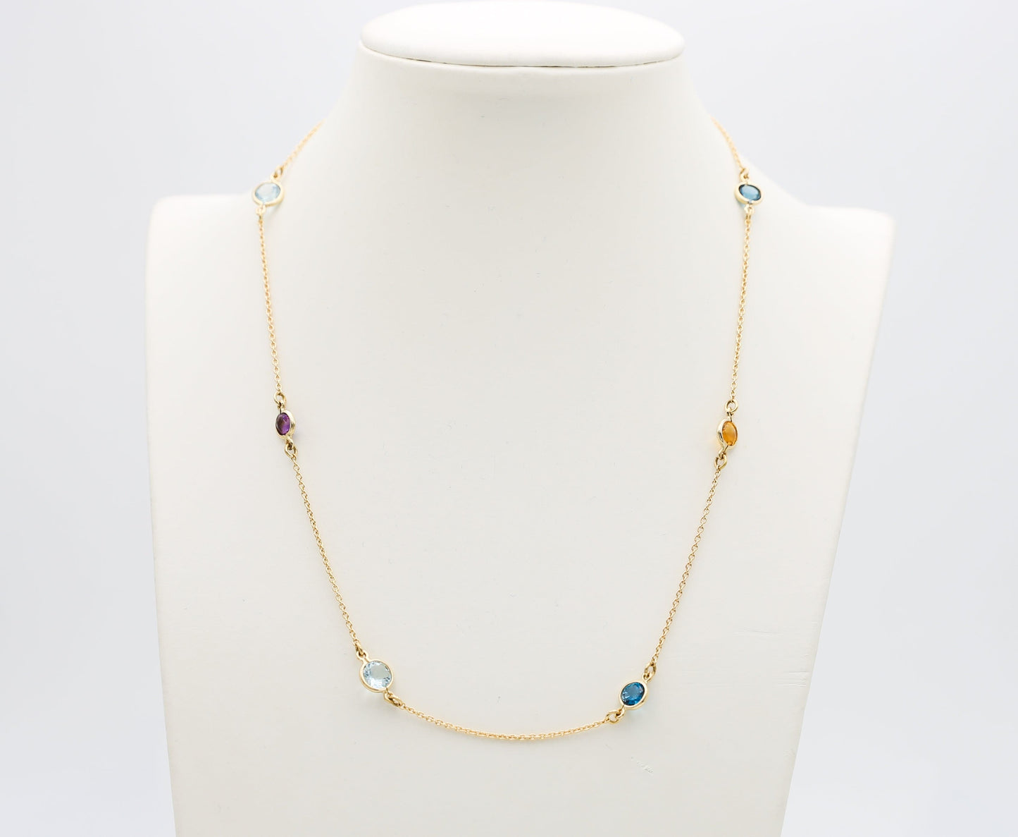 Collana in oro con Acquamarina Topazi e Pietre