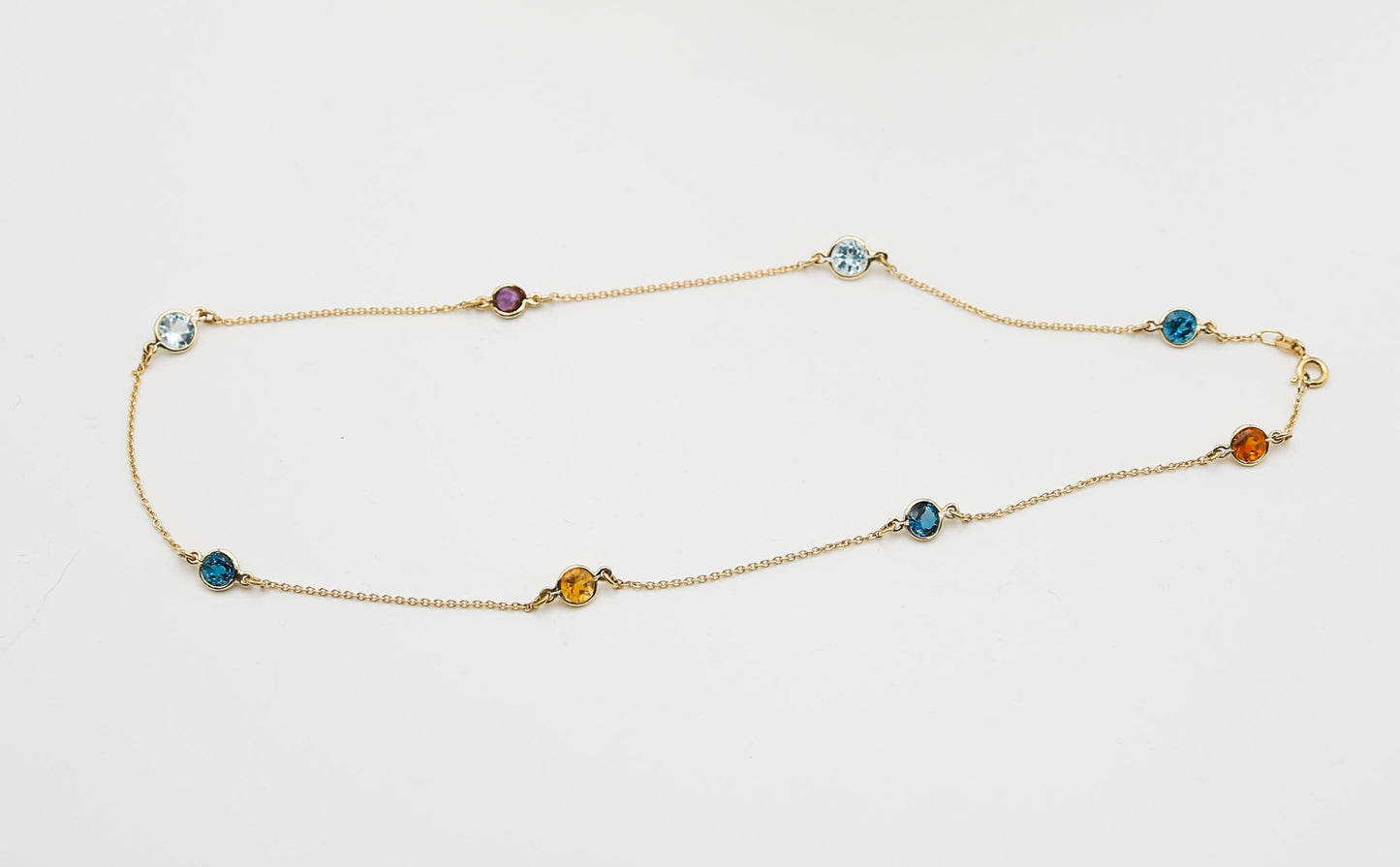 Collana in oro con Acquamarina Topazi e Pietre