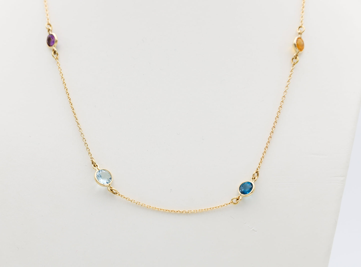 Collana in oro con Acquamarina Topazi e Pietre