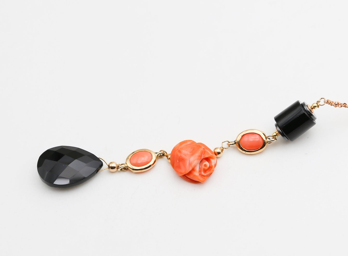 Gold necklace with coral and onyx