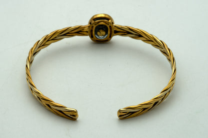 Bracciale rigido in oro giallo e pietre