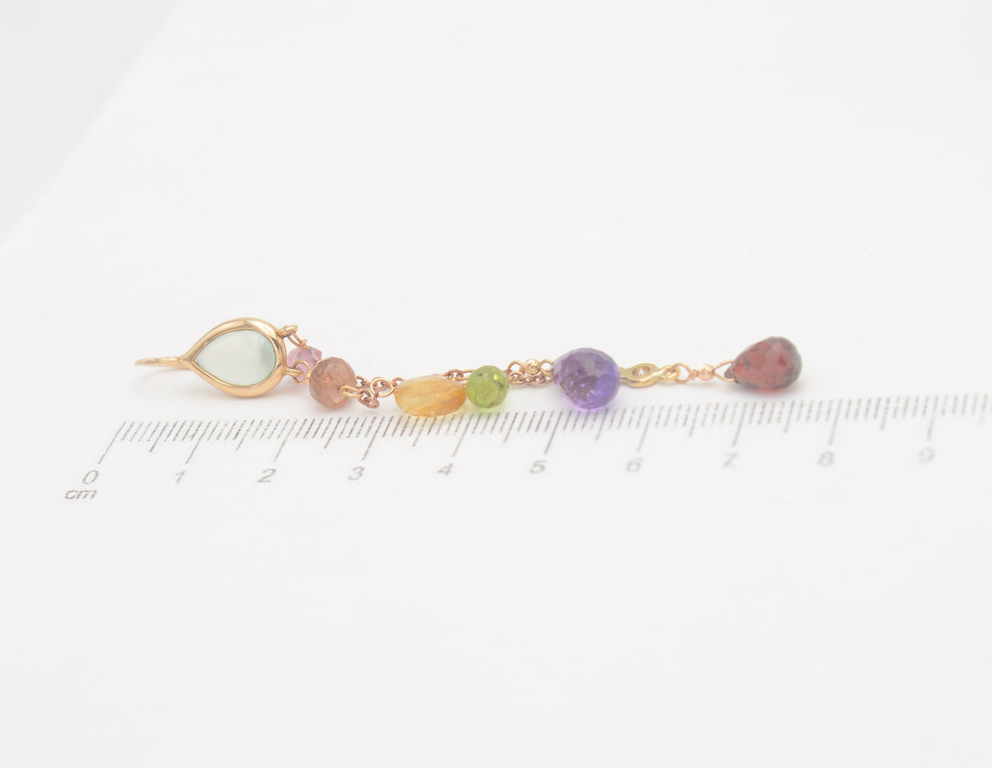 Gold earrings with diamonds and tourmalines